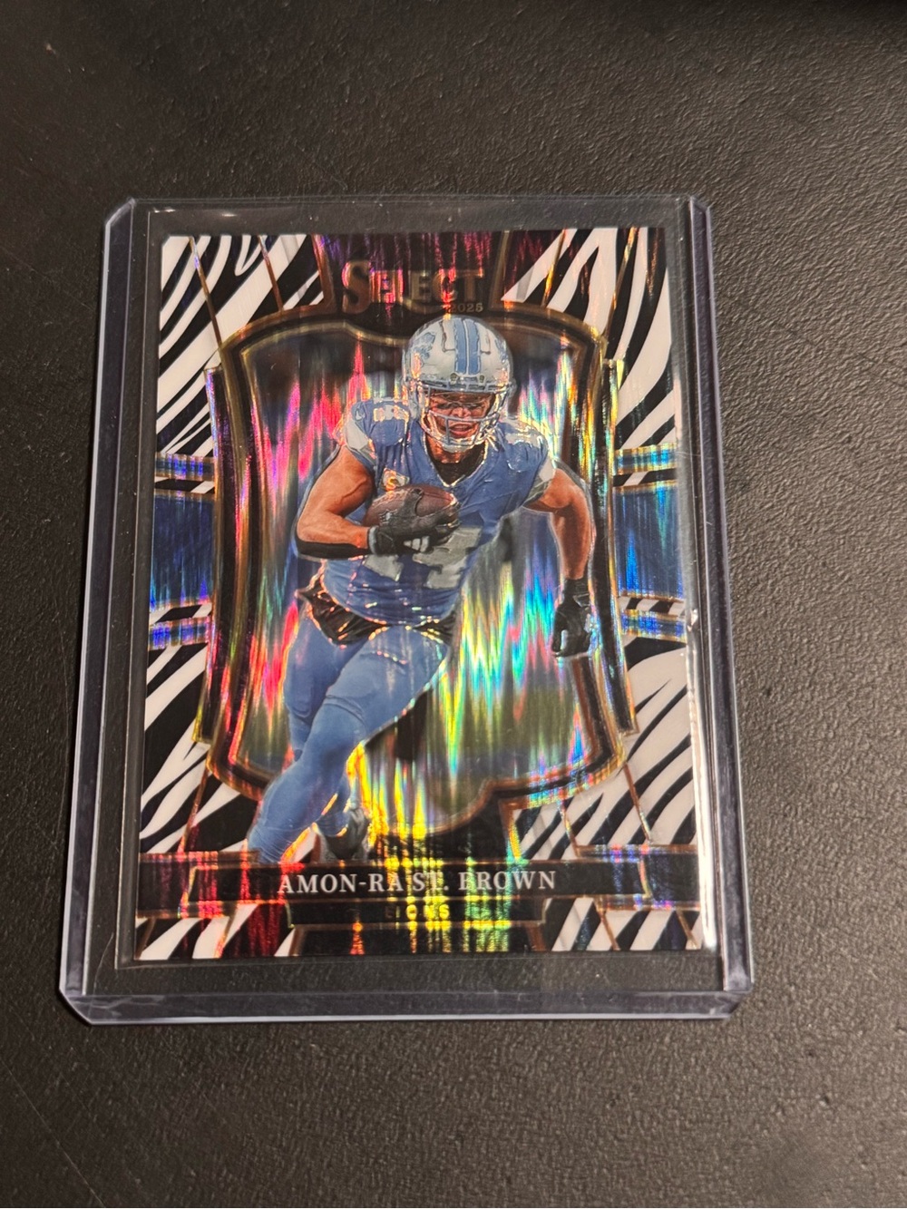 Panini 2025 Select Football Amon-Ra St. Brown #170 Premier Level Zebra Prizm SSP